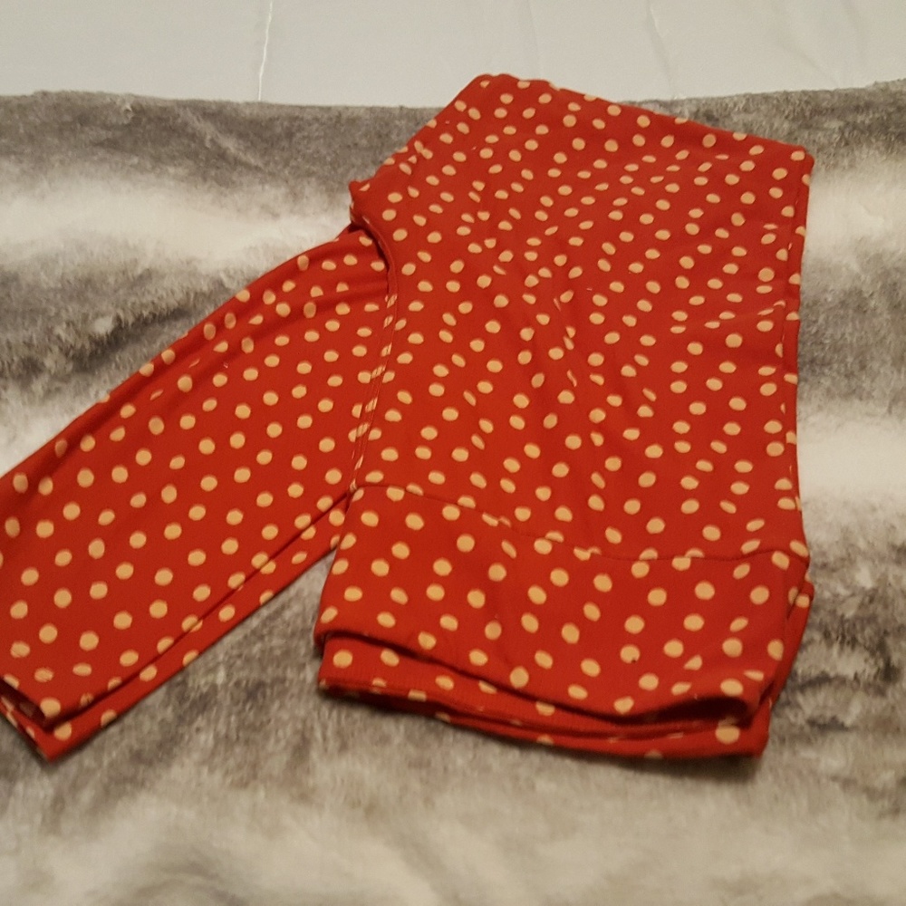 Lularoe orange polka dot leggings.